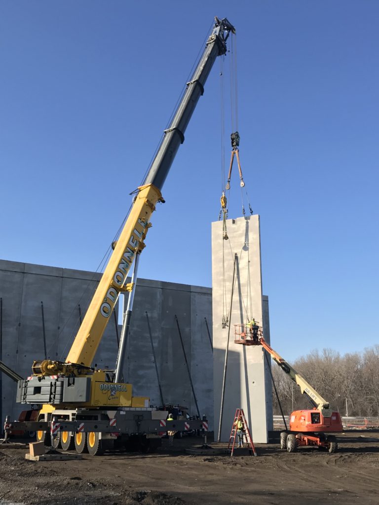 Crane Lifts Concrete Panel